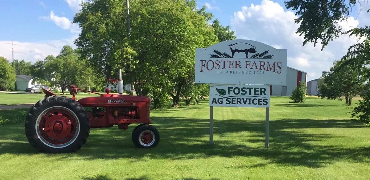 Foster Farms established 1903 — vintage tractor and signage